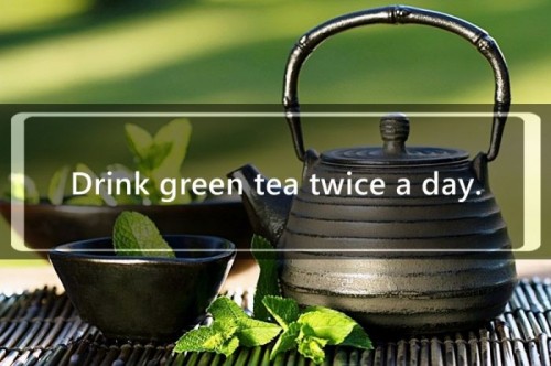 Black asian teapot with mint tea