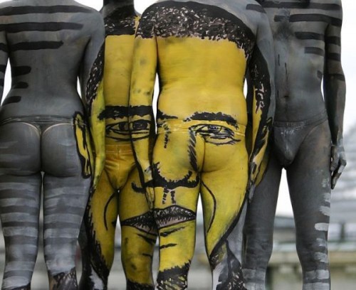 ** EDS NOTE NUDITY ** The portrait of U.S. President Barack Obama is seen as a body painting  during the performance 'The Fusion Journey' of Swiss artist 'Dave' (No Last Name) in Berlin on Thursday, May 21, 2009.  (AP Photo/Markus Schreiber)