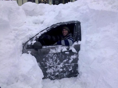 **CORRECTS CAR MODEL TO FORD FOCUS, NOT HONDA CIVIC** Dave Duncan sits in his Ford Focus, buried on the street Tuesday, Dec. 28, 2010 in Asbury Park, N.J. (AP Photo/Beth DeFalco)