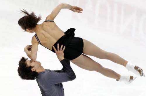 Canadian skater Meagan Duhamel hits Eric Radford with her elbow as they perform their pair's short program at the ISU Figure skating World championships in Moscow, Russia, Wednesday, April 27, 2011. (AP Photo/Dmitry Lovetsky)